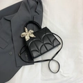 Black tote bag with fan-shaped quilting and cream floral scarf on handle - Black