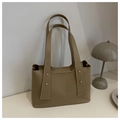 Detail view of khaki PU tote bag featuring wide shoulder straps and metallic stud accents - Khaki