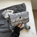 Detail of wave pattern fabric shoulder bag with golden metal closure and wide strap - Gray