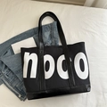 Grande borsa tote nera con stampa noco bianca e manici in pelle per ufficio - Nero