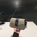Classic shoulder bag with vintage monogram pattern and gold geometric clasp closure - Black