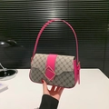 Retro monogram shoulder bag in dark brown canvas with vibrant magenta leather accents - Pink