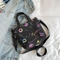 Black canvas tote bag with colorful gradient lettering and adjustable nylon strap - Black