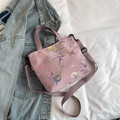 Pink tote bag with colorful laser letters and purple straps on blue denim background - Deep Pink