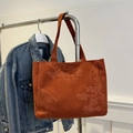 Brick red corduroy tote bag with embossed Chinese floral patterns and sturdy straps - Brown