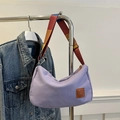 Light purple canvas shoulder bag with a colorful striped strap and leather patch - Purple
