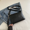 Black crocodile pattern crossbody bag with adjustable nylon strap and gold hardware - Black