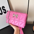 Pink quilted square crossbody bag with a metallic silver bow and chain strap - Rose Pink