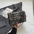 Retro underarm bag with black and grey leopard print and dark gunmetal chain strap - Black