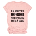 Detail of pink cotton T-shirt featuring bold black 'Facts & Logic' slogan text - Pink (Black Print)