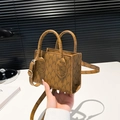 Mini brown handbag featuring M-letter monogram print with golden hardware and handles - Brown