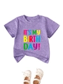 Flat lay of purple heather birthday t-shirt with white bow lace baby shoes - 90cm / Purple