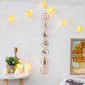 Boho raw crystal gemstone wall decor with seven colorful stones and gold metal rings - Danxia Seven Rings Rough Stone