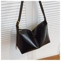 Detailed macro view of black PU leather hobo bag with a premium golden square metal buckle - Black