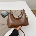 Minimalist hobo underarm bag in dark brown leather with gold chain and orb detail - Brown