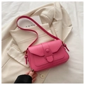 Fashionable magenta leather shoulder bag with flap closure on cream blazer - Rose Pink