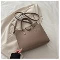 Brown faux leather tote bag with lychee texture and gold buckle in a stylish setting - Dark Khaki