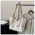 Minimalist beige leather tote bag with khaki trim and pink polka dot silk scarf detail - Dark Khaki
