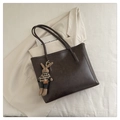 Detail of dark brown leather tote bag with a cute rabbit doll charm and fine grain texture - With Pendant / Coffee