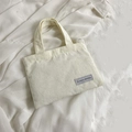 Mini borsa tote in velluto a coste crema con strisce e etichetta tessuta - Bianco