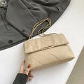 Chic beige quilted crossbody bag with gold chain strap and metal bar lock closure - Khaki
