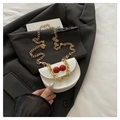White mini saddle crossbody bag with 3D cherry accent and double gold chain straps - White