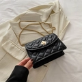 Classic black quilted leather crossbody bag with golden chain strap and twist lock - Black