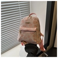 Detail eines rosa Jacquard-Minirucksacks mit floralem Muster und goldener Hardware - Rosa