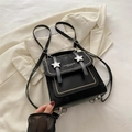 Minimalist black leather backpack with silver star buckles and vintage design details - Black