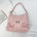 Borsa a spalla rosa in tessuto plissettato lucido con dettagli di fiocchi decorativi - Rosa