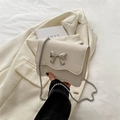 Creamy beige crossbody bag with silver butterfly metal buckle and chain strap - White