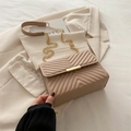 Elegant beige V-shaped quilted crossbody bag with gold chain strap on blazer - Khaki