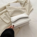 Minimalist white leather crossbody bag with structured flap and curved top handle - White