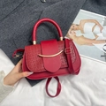 Red textured crossbody bag with gold crescent buckle and matching leather shoulder strap - Red