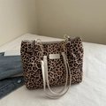 Leopard print tote bag with white strap and gold chain detail on a white background - Leopard Print