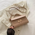 Minimalist beige leather crossbody bag with dual zipper detail and gold hardware - Khaki