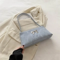 Chic light blue pleated crossbody bag with a decorative silver bow buckle detail - Blue