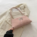 Pink marble pattern crossbody bag with silver metal bow detail and sleek finish - Pink