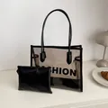 Detail of transparent PVC tote bag with black inner pouch and Fashion lettering - Black