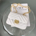 Elegant white V-quilted crossbody bag with gold chain strap and metal lock closure - White