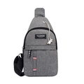 Grey oxford fabric crossbody chest bag with fashion patch and external earphone port - Gray