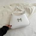 Elegant white shoulder bag with silver bow accent and slim cord strap for women - White
