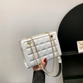 Chic white quilted shoulder bag with gold chain and black-and-white contrast strap - White