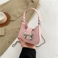 Pink crescent shoulder bag with metallic bow detail and silver chain strap - Pink