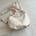 Minimalist beige crescent moon underarm bag with Fashion label and smooth PU leather finish - White
