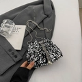 Chic black sequin bucket bag with metal chain strap and pearl drawstring detail - Silver