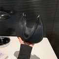 Minimalist black crescent shoulder bag with golden metal buckle and matte texture - Black