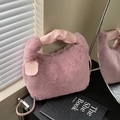 Pink plush faux fur handbag with ruched leather handle and engraved circular tag - Purple