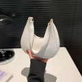 Chic white crescent hobo bag with gold hardware and minimalist textured leather finish - White