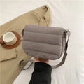 Sleek grey quilted crossbody bag with flap closure and adjustable strap for women - Gray